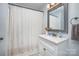 Cozy bathroom with neutral colors, updated vanity and mirror and shower at 200 Cleveland Ave, Shelby, NC 28150