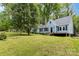 Beautiful light-blue home boasts lush green lawn and a picturesque setting surrounded by mature trees at 200 Cleveland Ave, Shelby, NC 28150