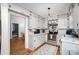 Cozy kitchen boasts updated countertops and lighting, plus beautiful hardwood flooring at 200 Cleveland Ave, Shelby, NC 28150