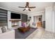 Cozy living room showcasing a fireplace, built-in shelving, and ceiling fan at 200 Cleveland Ave, Shelby, NC 28150