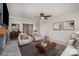 Bright living room featuring a fireplace, ceiling fan, and neutral decor at 200 Cleveland Ave, Shelby, NC 28150