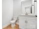Bathroom with white vanity, quartz countertop, and modern fixtures at 2011 Cedar Falls Dr # 71, Waxhaw, NC 28173