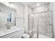A modern bathroom with gray tile, a glass shower, and a white vanity at 2011 Cedar Falls Dr # 71, Waxhaw, NC 28173