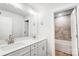 Modern bathroom showcasing a dual sink vanity and a combined shower-tub at 2011 Cedar Falls Dr # 71, Waxhaw, NC 28173