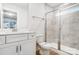 Bright bathroom featuring a shower with glass doors, toilet, and vanity at 2011 Cedar Falls Dr # 71, Waxhaw, NC 28173