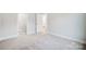 Well-lit bedroom features plush carpet flooring, large closet, and ensuite bathroom at 2011 Cedar Falls Dr # 71, Waxhaw, NC 28173
