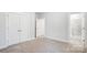 A bright bedroom featuring carpet, a large closet, and an attached bathroom at 2011 Cedar Falls Dr # 71, Waxhaw, NC 28173