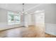 Bright dining room with large windows, coffered ceiling, and classic chandelier at 2011 Cedar Falls Dr # 71, Waxhaw, NC 28173