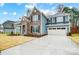 Beautiful two-story home with a two-car garage and spacious driveway, blending style and functionality at 2011 Cedar Falls Dr # 71, Waxhaw, NC 28173