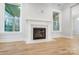 Close-up of a marble fireplace featuring a beautifully crafted mantle in a bright living area at 2011 Cedar Falls Dr # 71, Waxhaw, NC 28173