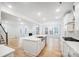 Open-concept living room and kitchen with hardwood floors and lots of natural light at 2011 Cedar Falls Dr # 71, Waxhaw, NC 28173