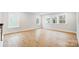 Living room featuring hardwood floors, natural lighting, and white trim at 2011 Cedar Falls Dr # 71, Waxhaw, NC 28173
