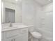 Bright bathroom with a white vanity, toilet, and shower/tub combination for all your needs at 2021 Boynton St, Charlotte, NC 28269