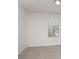 Clean bedroom with window and neutral colored carpet at 2021 Boynton St, Charlotte, NC 28269