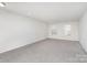 Spacious bedroom with two windows and neutral carpet at 2021 Boynton St, Charlotte, NC 28269