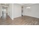 Open dining area with modern chandelier and wood-look flooring at 2021 Boynton St, Charlotte, NC 28269