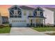 Inviting two-story home with a two-car garage, craftsman architecture, and manicured lawn at 2021 Boynton St, Charlotte, NC 28269