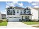 Inviting two-story home with a two-car garage, craftsman architecture, and manicured lawn at 2021 Boynton St, Charlotte, NC 28269