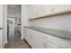 Kitchen cabinets with granite countertops and tile backsplash offer lots of storage at 2021 Boynton St, Charlotte, NC 28269