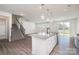 Open-concept kitchen and living space filled with natural light and featuring a center island at 2021 Boynton St, Charlotte, NC 28269