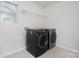 Convenient laundry room equipped with a modern washer and dryer, offering efficiency and functionality at 2021 Boynton St, Charlotte, NC 28269