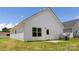 Exterior of home with a backyard and green grass at 220 S Columbia St, Gastonia, NC 28054