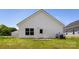 Exterior of home with a backyard and green grass at 220 S Columbia St, Gastonia, NC 28054