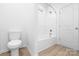 Bright bathroom with a shower-tub combo, white fixtures, and clean design at 220 S Columbia St, Gastonia, NC 28054