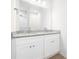 Elegant bathroom vanity with double sinks, granite countertops, and white cabinetry at 220 S Columbia St, Gastonia, NC 28054