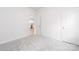 Neutral bedroom with carpet, featuring a hallway view to the kitchen, multiple electrical outlets, and a bright airy feel at 220 S Columbia St, Gastonia, NC 28054