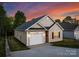 Charming home featuring a single-car garage and well-maintained landscaping at 220 S Columbia St, Gastonia, NC 28054