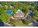 Beautiful aerial view showcasing the community pool, clubhouse, and tennis courts amidst lush greenery at 2215 Maycroft Dr, Charlotte, NC 28262