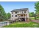 Beautiful backyard featuring a pool, patio, deck, and lush landscaping at 2215 Maycroft Dr, Charlotte, NC 28262
