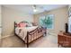 Comfortable bedroom with a metal frame bed, bright window, and quaint wooden nightstand at 2215 Maycroft Dr, Charlotte, NC 28262