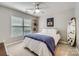 Well-lit bedroom featuring a bed, window, and nautical-themed decor, perfect for a  at 2215 Maycroft Dr, Charlotte, NC 28262