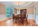 Elegant dining room with a hardwood floor, chandelier, and hutch at 2215 Maycroft Dr, Charlotte, NC 28262