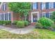Charming front entrance with a landscaped walkway and wreath-adorned door at 2215 Maycroft Dr, Charlotte, NC 28262