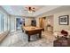 Enjoy the game room featuring a pool table, bar area, and stylish decor at 2215 Maycroft Dr, Charlotte, NC 28262
