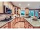 Gourmet kitchen with granite countertops, island, and stainless steel appliances at 2215 Maycroft Dr, Charlotte, NC 28262