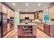 Spacious kitchen featuring custom cabinets, a center island, and stainless appliances at 2215 Maycroft Dr, Charlotte, NC 28262