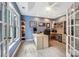 Well-lit home office with modern desk, built-in shelves, and large windows at 2215 Maycroft Dr, Charlotte, NC 28262