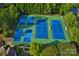 Aerial view of community tennis courts with well-maintained green and blue courts surrounded by trees at 2215 Maycroft Dr, Charlotte, NC 28262