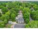 A high shot shows a home with a well-manicured yard and mature trees surrounding it at 226 Union S St, Concord, NC 28025
