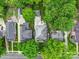 Aerial view of a home featuring a well-manicured yard and mature trees at 226 Union S St, Concord, NC 28025