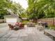 Spacious backyard featuring a patio, outdoor seating, a grill, and a well-maintained lawn at 226 Union S St, Concord, NC 28025