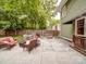 Spacious backyard featuring a patio, outdoor seating, a grill, and a well-maintained lawn at 226 Union S St, Concord, NC 28025