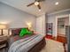 Cozy bedroom with a ceiling fan, lamps, and a comfortable bed, creating a relaxing atmosphere at 226 Union S St, Concord, NC 28025