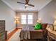 Serene bedroom featuring a comfortable bed, hardwood floors, and ample natural light at 226 Union S St, Concord, NC 28025