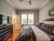 Comfortable bedroom with natural light, closet space, and an en-suite bathroom at 226 Union S St, Concord, NC 28025