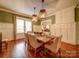 Charming dining room with hardwood floors, elegant lighting, and traditional wainscoting at 226 Union S St, Concord, NC 28025